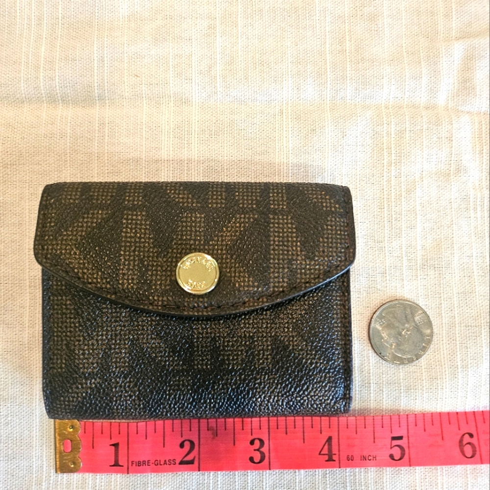 Sleek And Stylish Michael Kors Brown and Pink Interior Wallet.